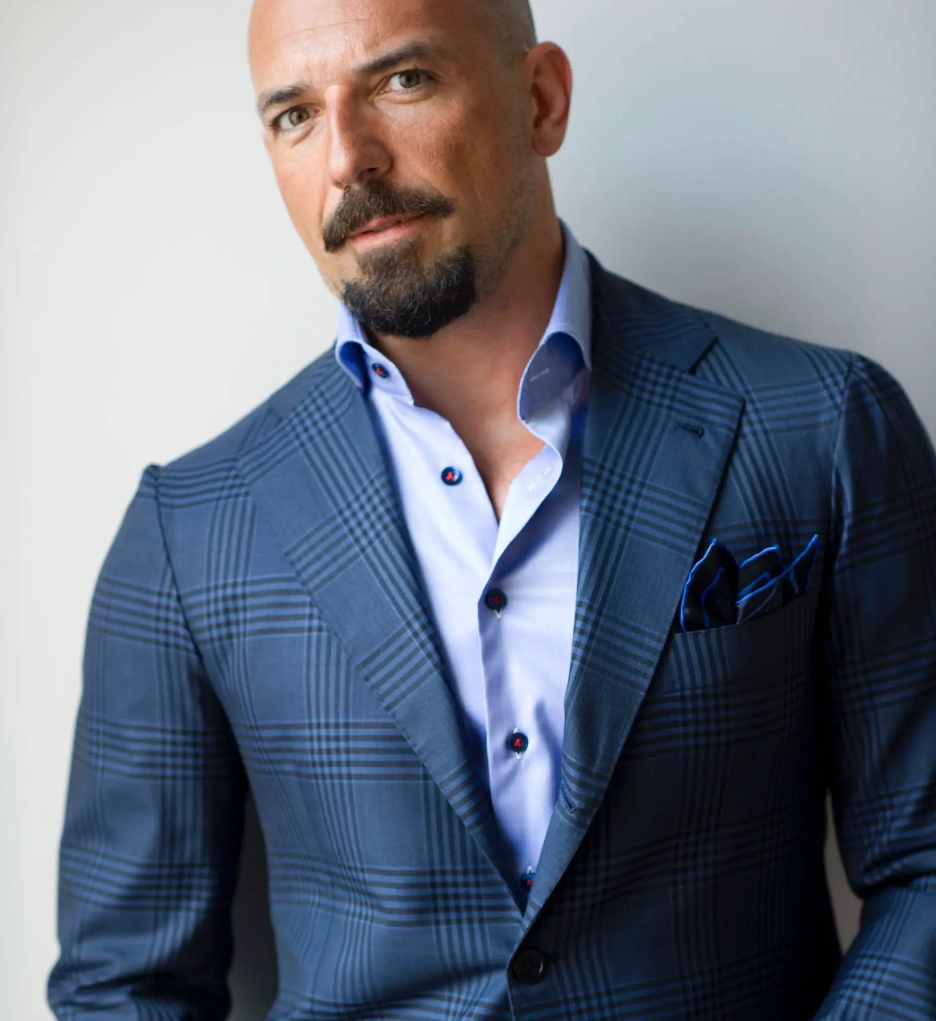 Bellucci House shoulder detail on a blue checked tailored jacket